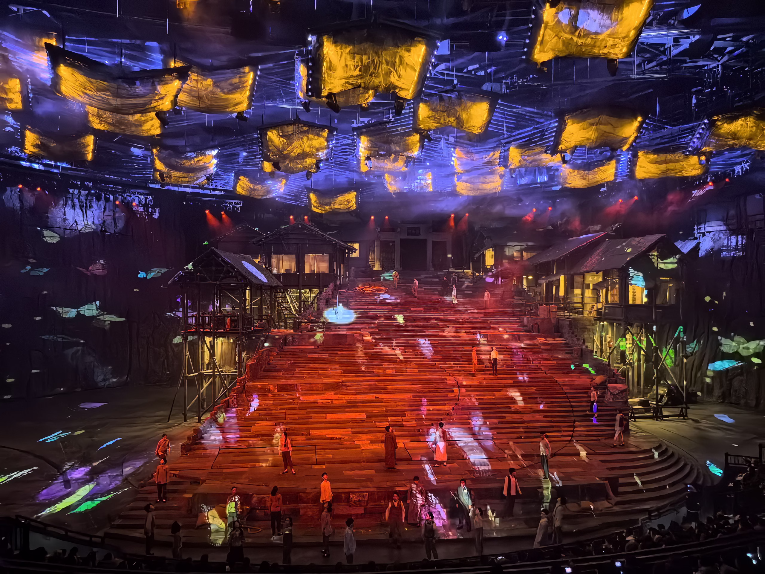 An illuminated multi-level stage at Chongqing 1949